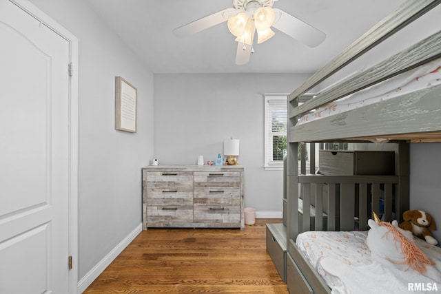 4040 27th Ave, Rock Island, IL 61201 - bedroom featuring wood finished floors and a ceiling fan
