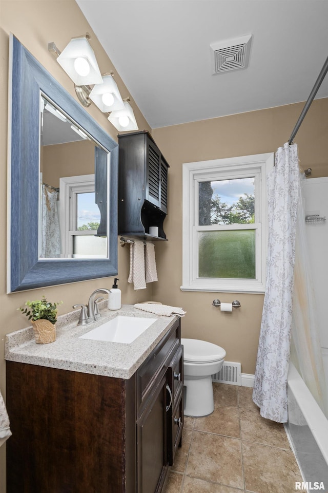 4040 27th Ave, Rock Island, IL 61201 - bathroom featuring vanity and shower / tub combo with curtain