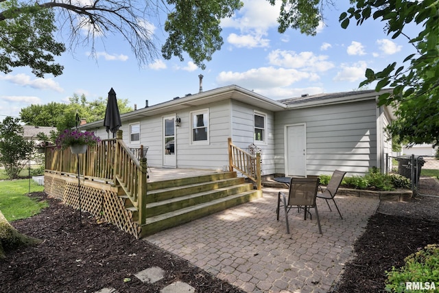 4040 27th Ave, Rock Island, IL 61201 - back of house featuring a patio and a wooden deck