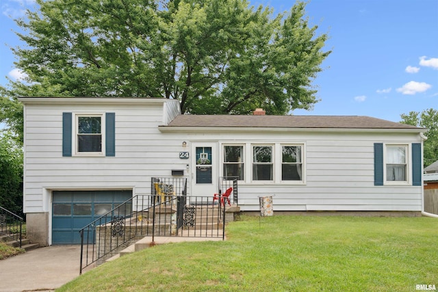 24 Berkshire Dr, Rock Island, IL 61201 - split level home with an attached garage, concrete driveway, a front lawn, and a chimney