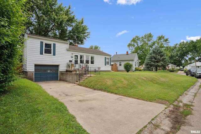 24 Berkshire Dr, Rock Island, IL 61201 - tri-level home featuring a garage, a front lawn, concrete driveway, and a chimney