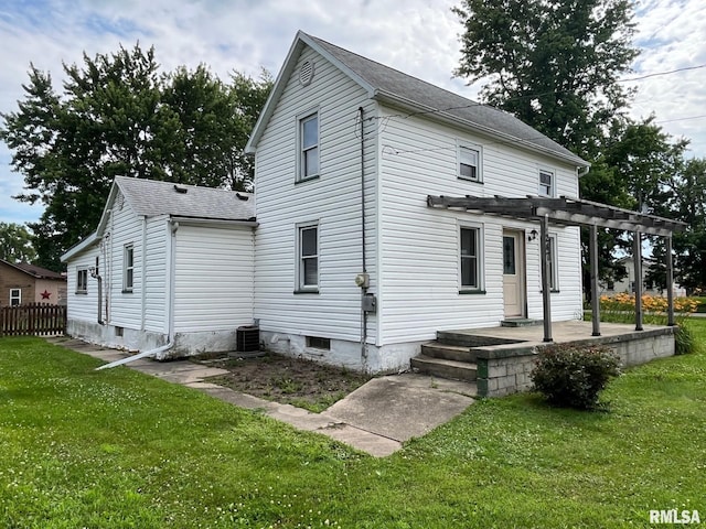 247 W Garfield St, Kewanee, IL 61443 - back of property featuring a pergola, roof with shingles, and a patio