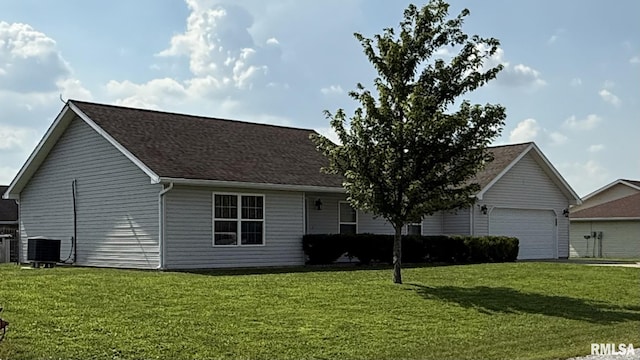 11279 Nora Ln, Carterville, IL 62918 - view of front of property with a front yard, an attached garage, and a shingled roof