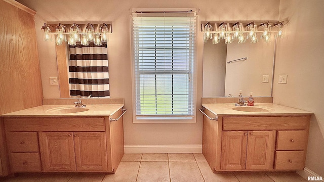 11279 Nora Ln, Carterville, IL 62918 - bathroom with two vanities and tile patterned floors