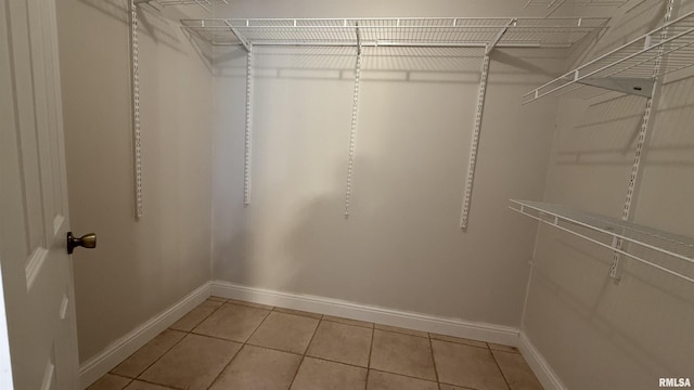 11279 Nora Ln, Carterville, IL 62918 - walk in closet featuring light tile patterned floors