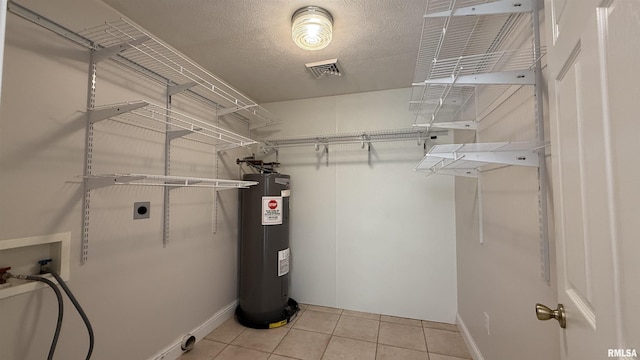 11279 Nora Ln, Carterville, IL 62918 - spacious closet with electric water heater and light tile patterned floors
