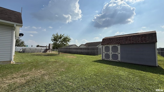11279 Nora Ln, Carterville, IL 62918 - fenced backyard featuring a storage unit and a playground
