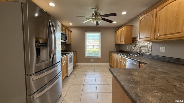 11279 Nora Ln, Carterville, IL 62918 - kitchen featuring appliances with stainless steel finishes, dark countertops, a ceiling fan, recessed lighting, and light tile patterned flooring