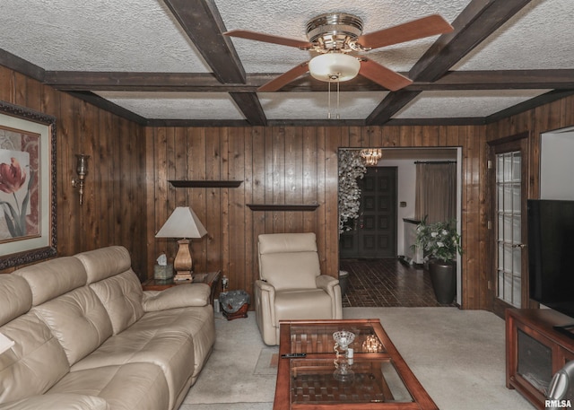 8527 W 17th St, Rock Island, IL 61201 - carpeted living area with wood walls, beam ceiling, ceiling fan, and a textured ceiling