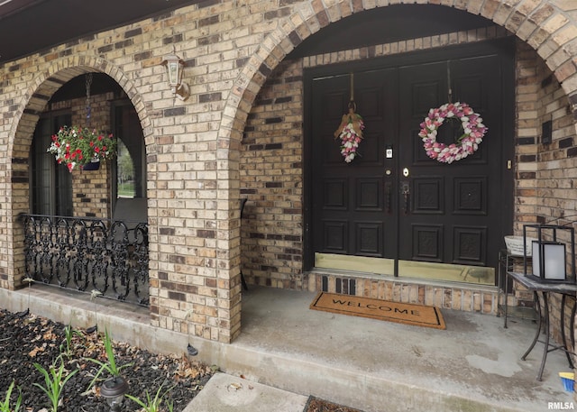 8527 W 17th St, Rock Island, IL 61201 - entrance to property with brick siding and covered porch
