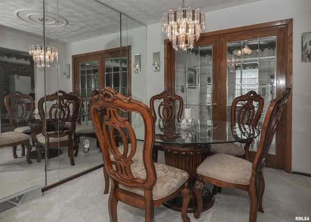 8527 W 17th St, Rock Island, IL 61201 - dining room with a chandelier, carpet flooring, and french doors