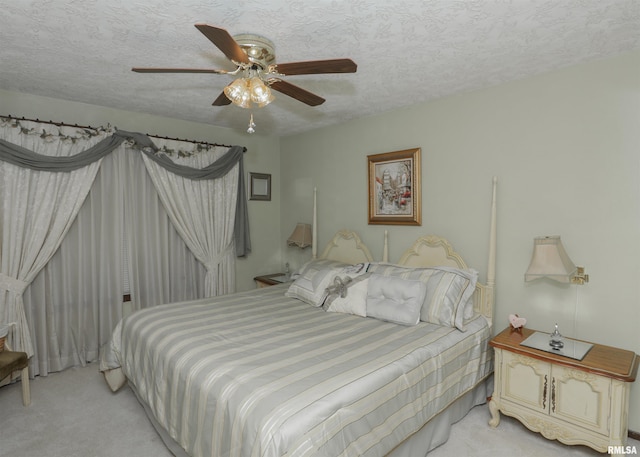 8527 W 17th St, Rock Island, IL 61201 - bedroom with light carpet, a textured ceiling, and a ceiling fan