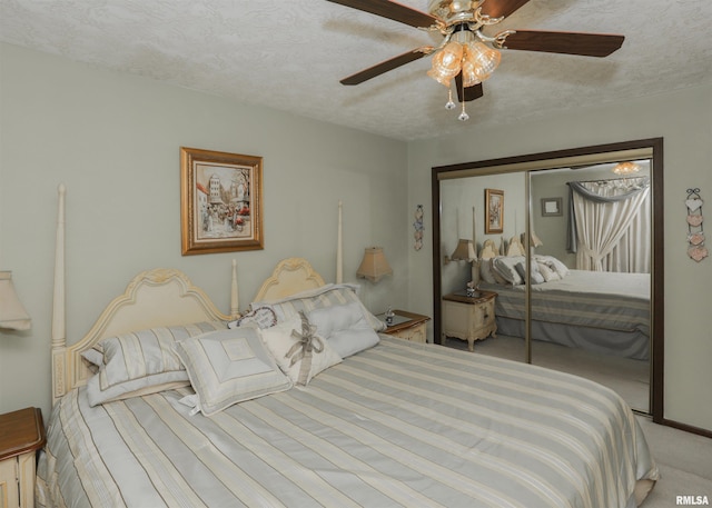 8527 W 17th St, Rock Island, IL 61201 - bedroom featuring carpet, a closet, ceiling fan, and a textured ceiling