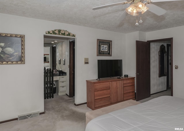 8527 W 17th St, Rock Island, IL 61201 - bedroom with light carpet, a textured ceiling, and ceiling fan