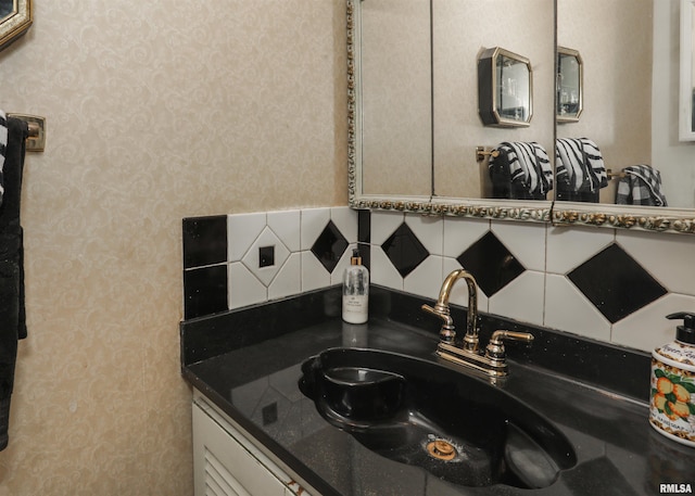 8527 W 17th St, Rock Island, IL 61201 - detailed view of vanity, wallpapered walls, and tasteful backsplash