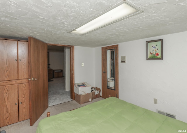 8527 W 17th St, Rock Island, IL 61201 - bedroom with light colored carpet and a textured ceiling