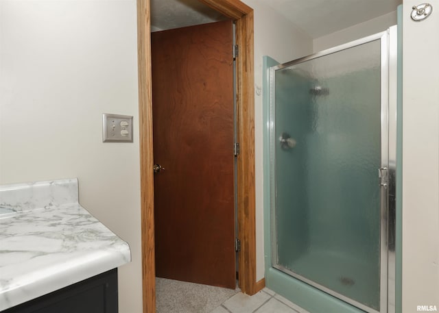 8527 W 17th St, Rock Island, IL 61201 - full bath with a stall shower, vanity, and tile patterned floors