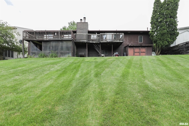 8527 W 17th St, Rock Island, IL 61201 - back of property with a yard, a chimney, and a deck