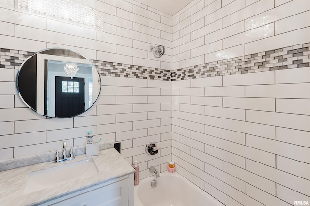401 W Grand Ave, Carterville, IL 62918 - bathroom featuring bathing tub / shower combination, vanity, and a chandelier