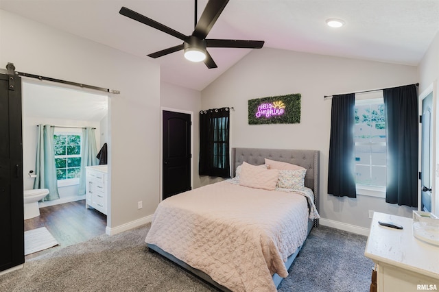 401 W Grand Ave, Carterville, IL 62918 - bedroom with carpet floors, vaulted ceiling, a barn door, ensuite bath, and ceiling fan