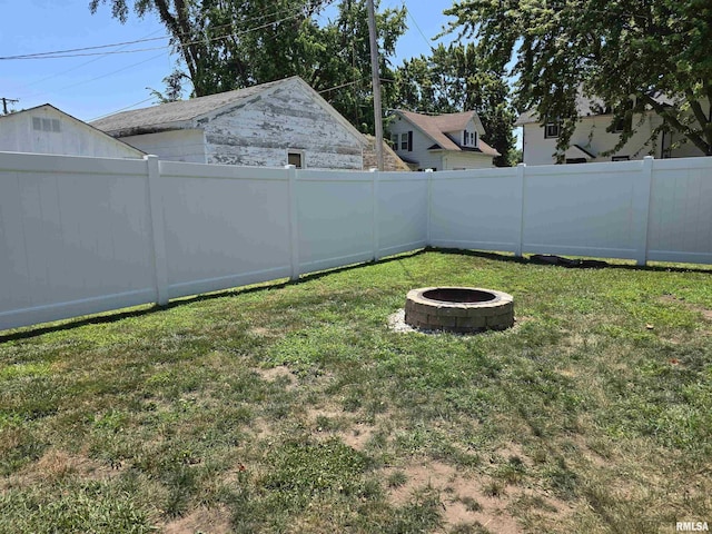 800 13th Ave, Fulton, IL 61252 - fenced backyard featuring an outdoor fire pit