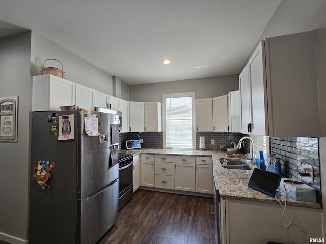 800 13th Ave, Fulton, IL 61252 - kitchen featuring freestanding refrigerator, dark wood finished floors, decorative backsplash, range, and white cabinets