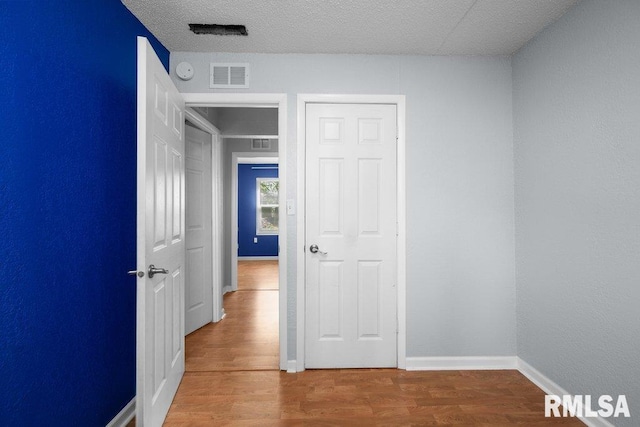 2043 30th St, Rock Island, IL 61201 - unfurnished bedroom featuring wood finished floors