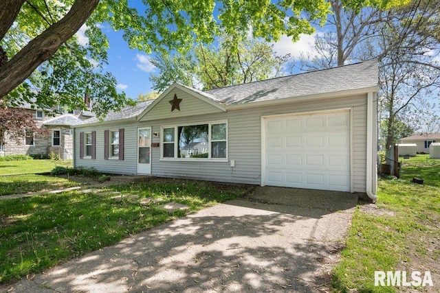 2043 30th St, Rock Island, IL 61201 - single story home with driveway, a garage, a front lawn, and roof with shingles