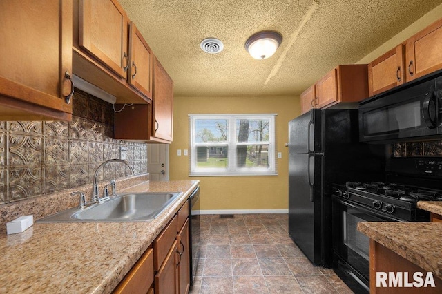 2043 30th St, Rock Island, IL 61201 - kitchen with black appliances, decorative backsplash, brown cabinetry, a textured ceiling, and light countertops
