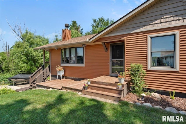 129 Glenview Dr, Sherrard, IL 61281 - rear view of house featuring a chimney, a wooden deck, and a yard