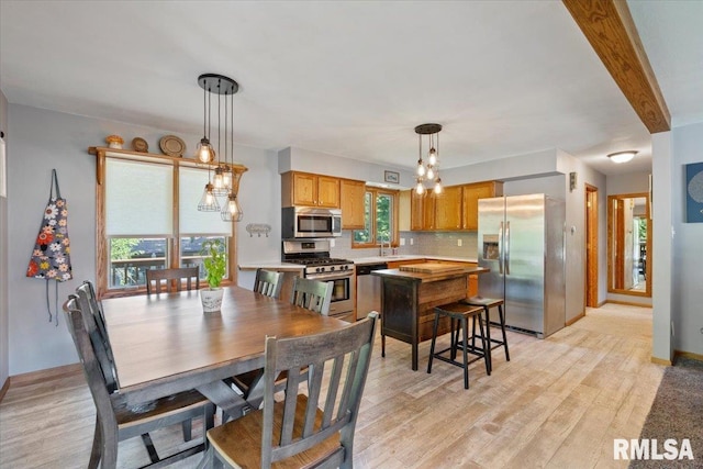 129 Glenview Dr, Sherrard, IL 61281 - dining area with light wood finished floors and baseboards