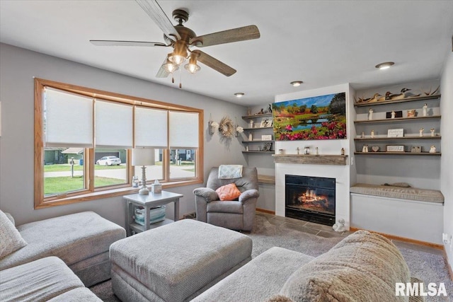 129 Glenview Dr, Sherrard, IL 61281 - living area with a glass covered fireplace and a ceiling fan