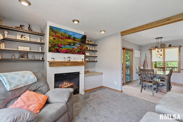 129 Glenview Dr, Sherrard, IL 61281 - living room featuring a chandelier, a fireplace with flush hearth, and recessed lighting