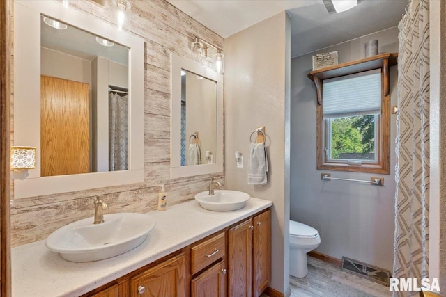 129 Glenview Dr, Sherrard, IL 61281 - full bathroom with double vanity and decorative backsplash