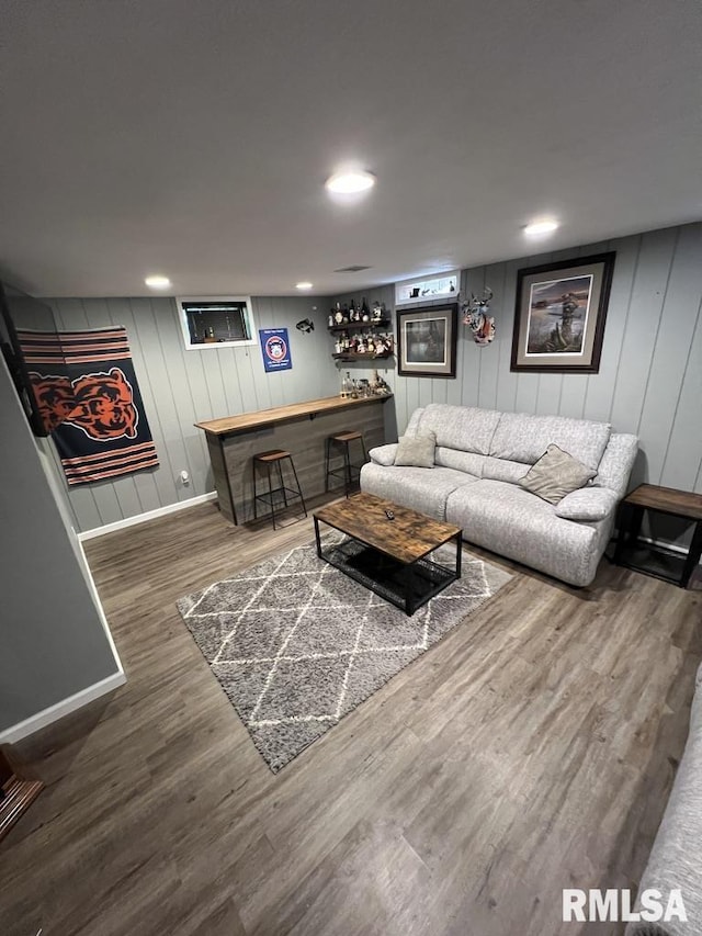 129 Glenview Dr, Sherrard, IL 61281 - living room with a dry bar, wood finished floors, a decorative wall, and recessed lighting