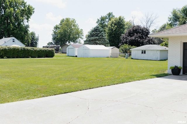 300 S 1st St, Camp Point, IL 62320 - view of yard with a garage and an outbuilding