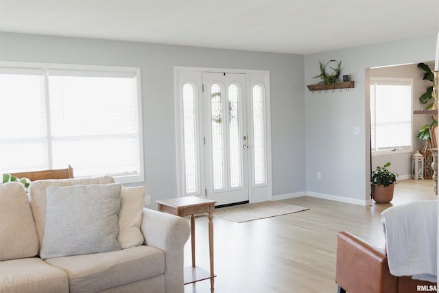 300 S 1st St, Camp Point, IL 62320 - entrance foyer with light wood-style flooring and baseboards