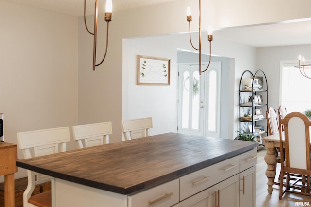 300 S 1st St, Camp Point, IL 62320 - dining space featuring plenty of natural light and a chandelier