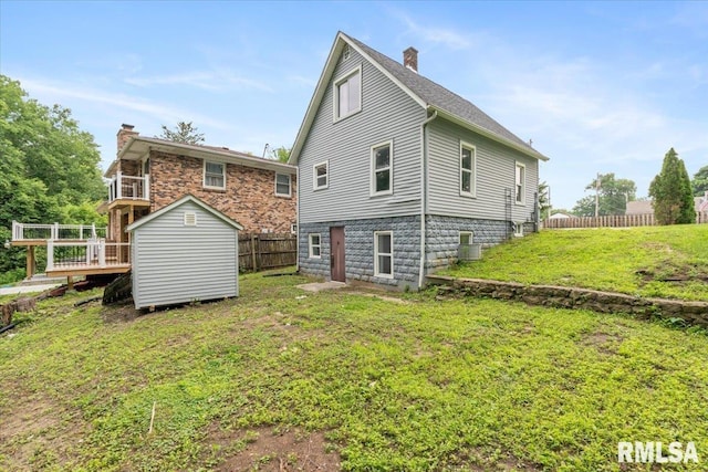 619 51st St, Moline, IL 61265 - back of house with a shed, a chimney, and a deck