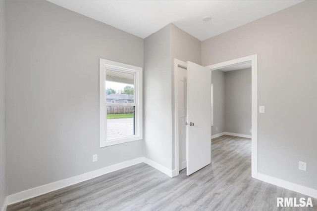 619 51st St, Moline, IL 61265 - spare room featuring light wood-type flooring