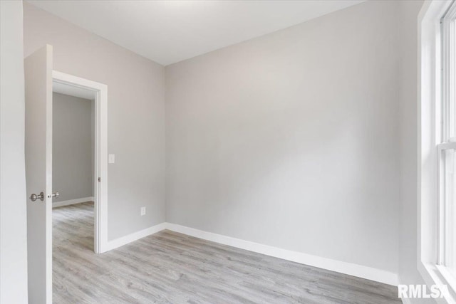 619 51st St, Moline, IL 61265 - spare room featuring light wood finished floors and baseboards