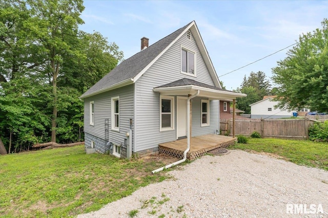 619 51st St, Moline, IL 61265 - view of front of house featuring a chimney, a porch, and roof with shingles
