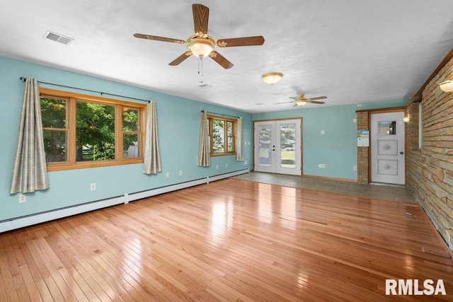 22 Pleasant View Dr, Annawan, IL 61234 - empty room featuring ceiling fan, wood-type flooring, and a baseboard radiator