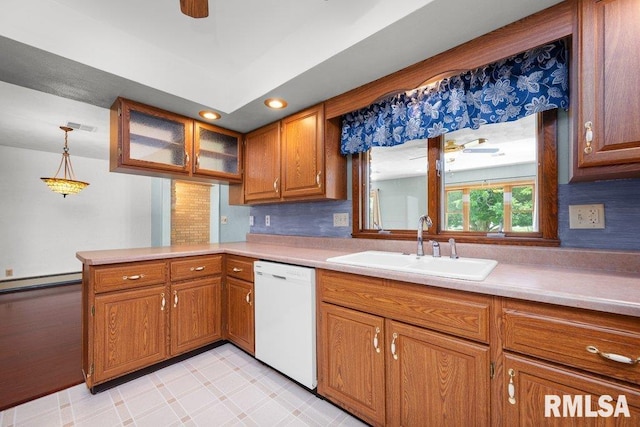 22 Pleasant View Dr, Annawan, IL 61234 - kitchen featuring dishwasher, brown cabinets, a peninsula, light countertops, and baseboard heating
