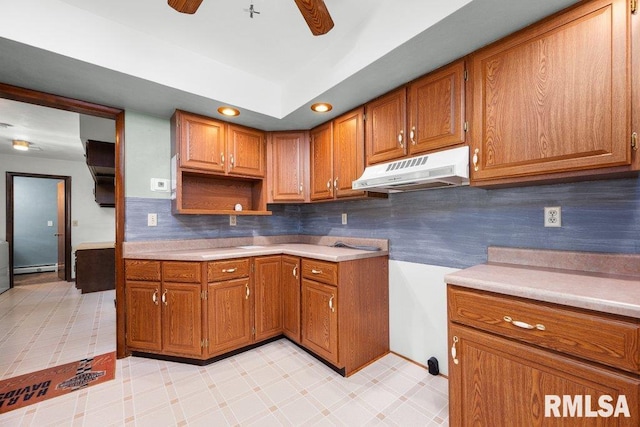 22 Pleasant View Dr, Annawan, IL 61234 - kitchen featuring under cabinet range hood, brown cabinetry, a ceiling fan, light countertops, and recessed lighting