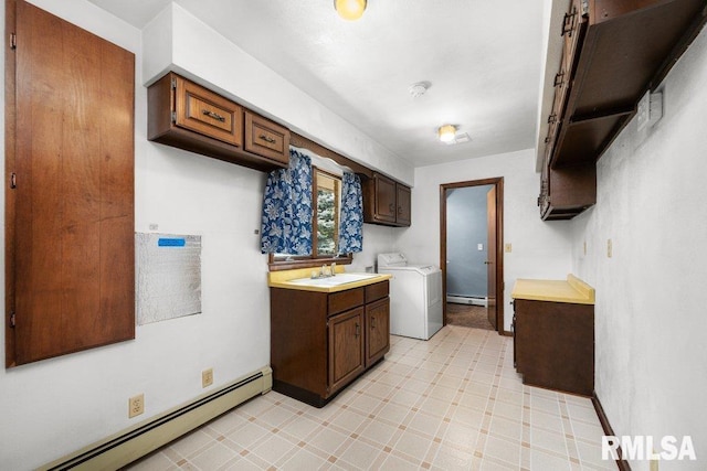 22 Pleasant View Dr, Annawan, IL 61234 - laundry area featuring washer / dryer, a baseboard heating unit, cabinet space, and light floors