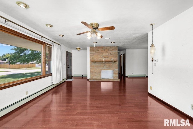 22 Pleasant View Dr, Annawan, IL 61234 - unfurnished living room featuring a baseboard heating unit, a ceiling fan, and wood finished floors
