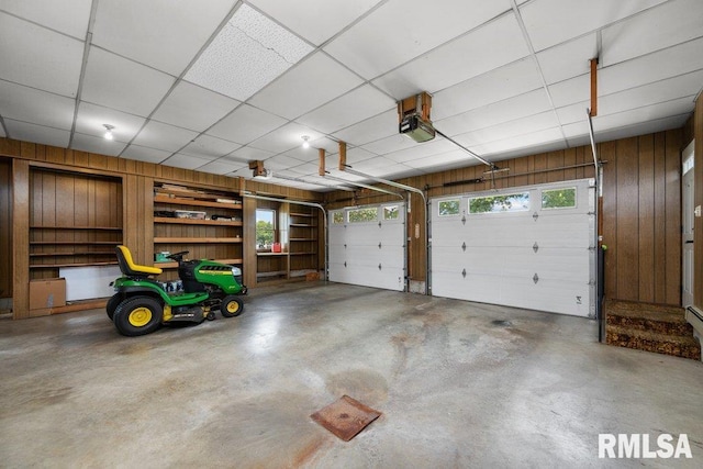 22 Pleasant View Dr, Annawan, IL 61234 - garage with wood walls and a garage door opener