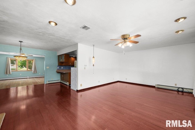 22 Pleasant View Dr, Annawan, IL 61234 - unfurnished living room featuring baseboard heating, ceiling fan, wood finished floors, and a baseboard heating unit