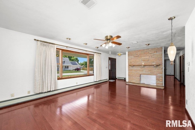 22 Pleasant View Dr, Annawan, IL 61234 - unfurnished living room with a baseboard radiator, wood finished floors, a ceiling fan, a stone fireplace, and a baseboard heating unit